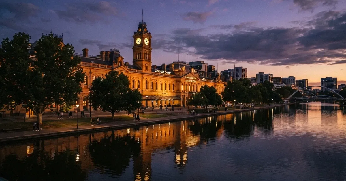 Heritage façade of the SkyCity Adelaide building on North Terrace at dusk, River Torrens in the foreground